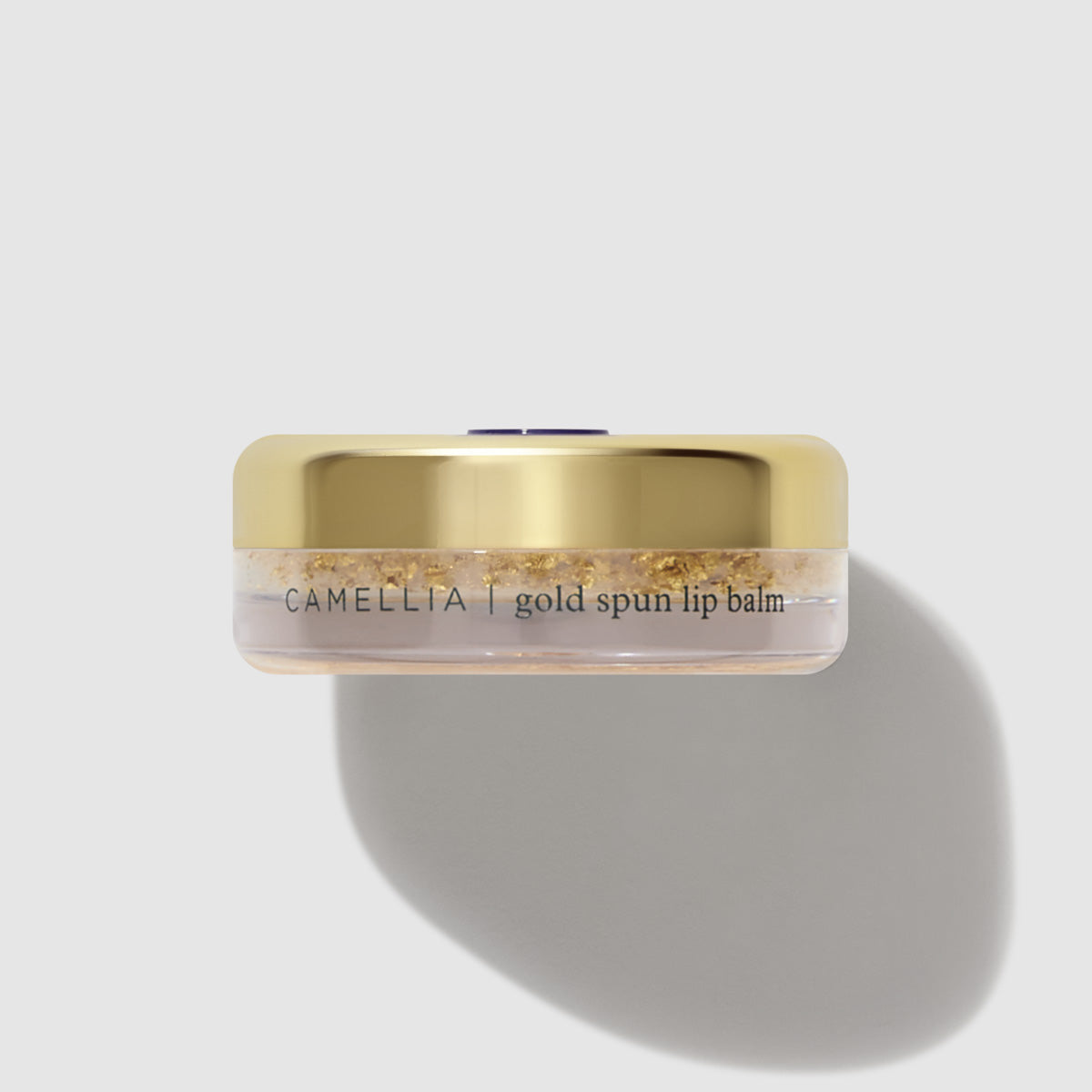 Camellia Gold Spun Lip Balm, cap off.