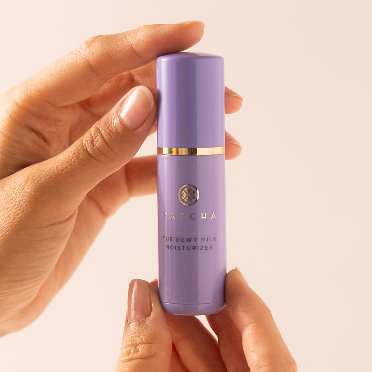 Hands holding Dewy Milk Mini