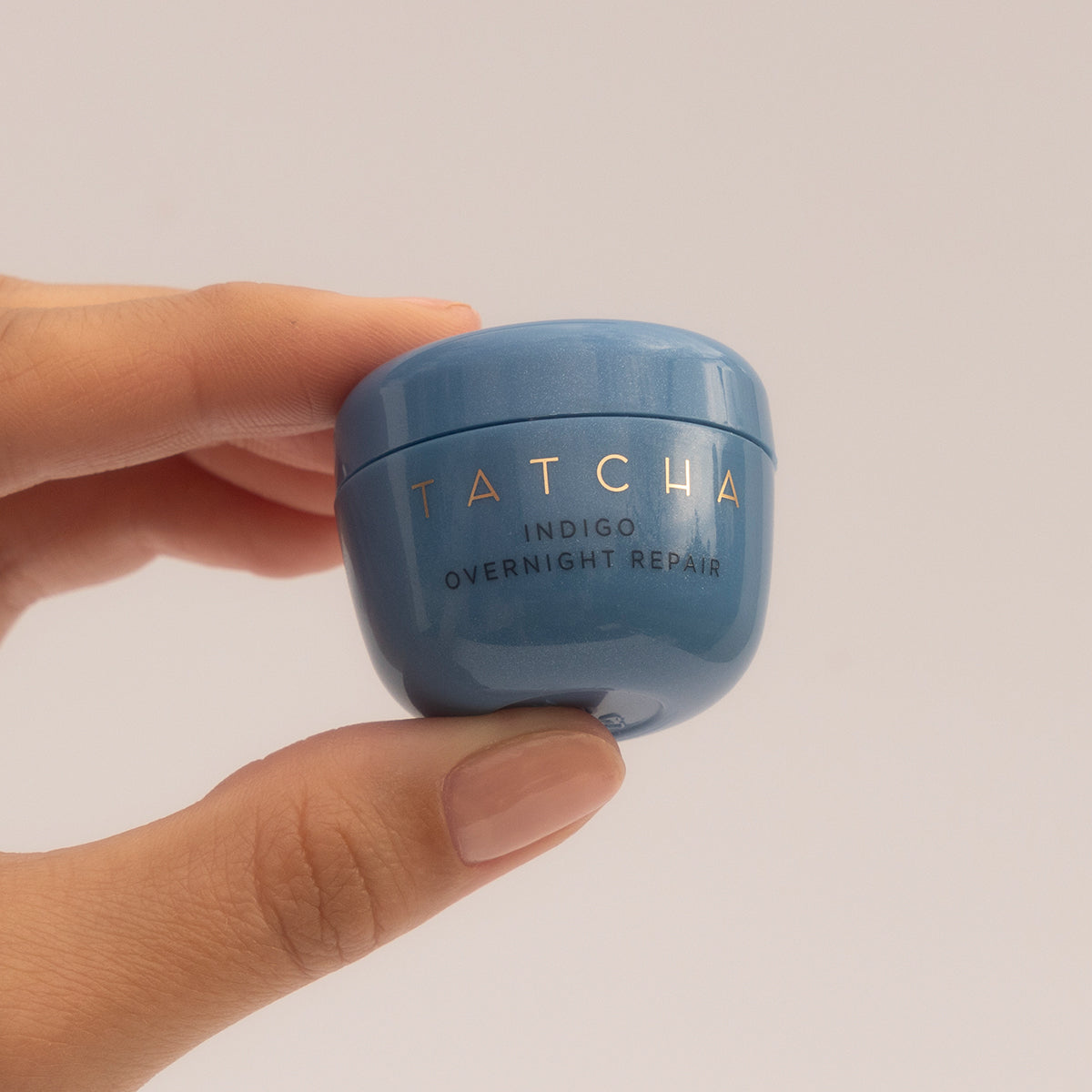 Hand holding Indigo Overnight Repair