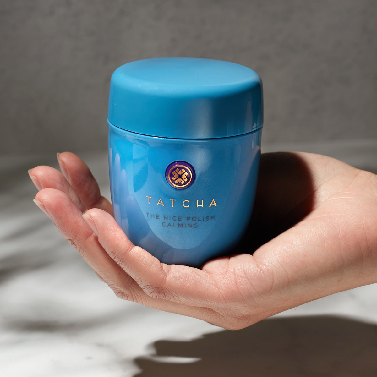 Hand holding Rice Polish Calming