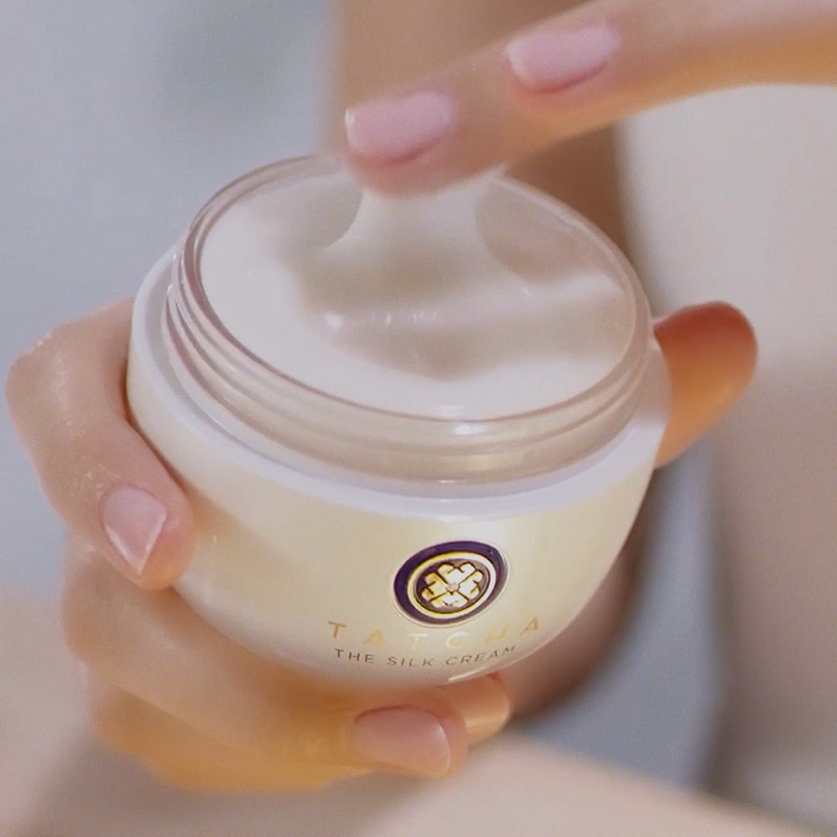 Hand holding Silk Cream