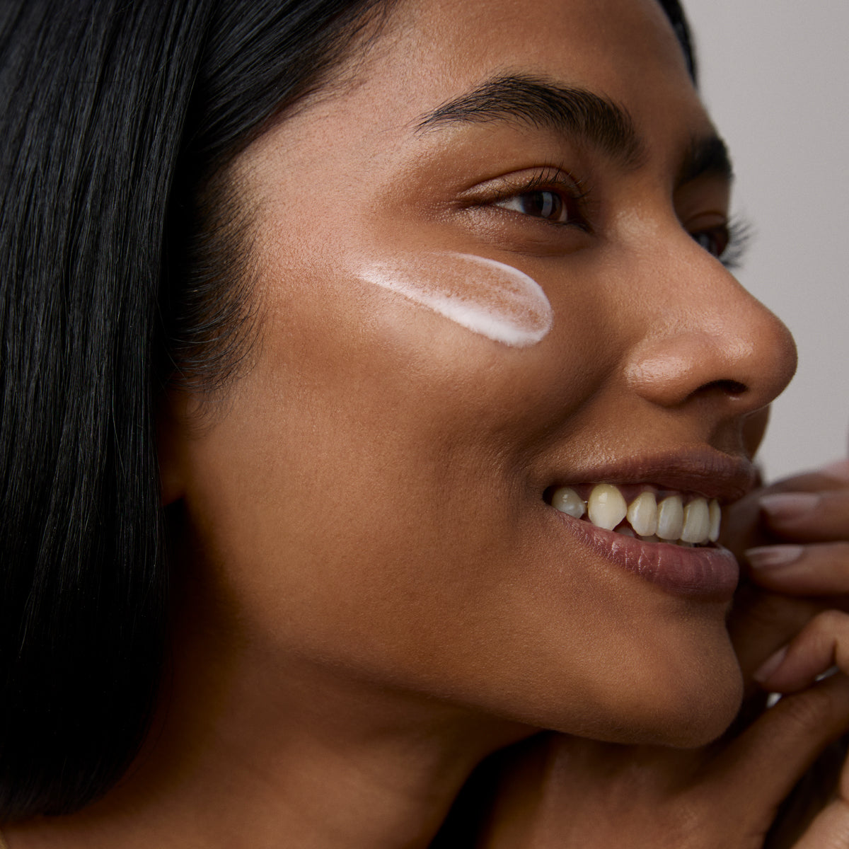 Model application showcasing the Tatcha Silk Serum