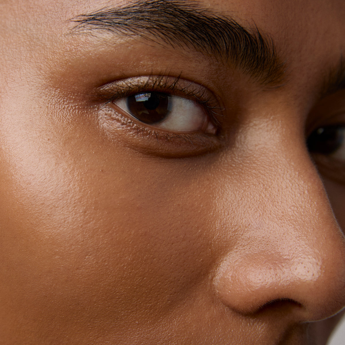 Model skin finish after using the Tatcha Brightening Eye Cream