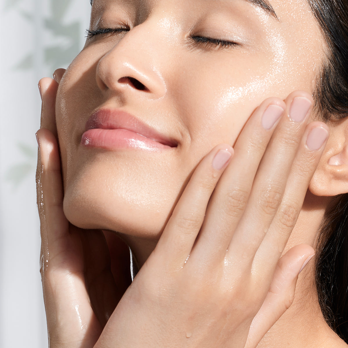 Woman applying the Essence