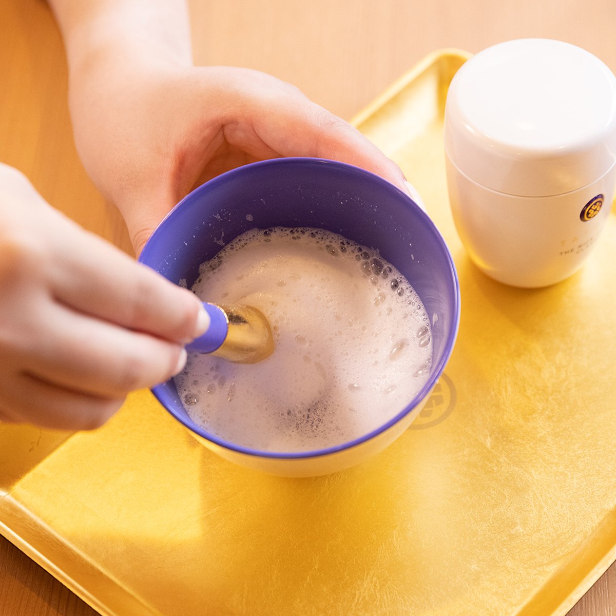 Original Facial Cleansing Brush by Kashoen 1883 creating a foam from The Rice Polish for exfoliation.