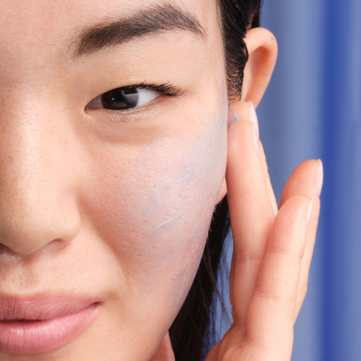 Model applying Indigo Calming Cream