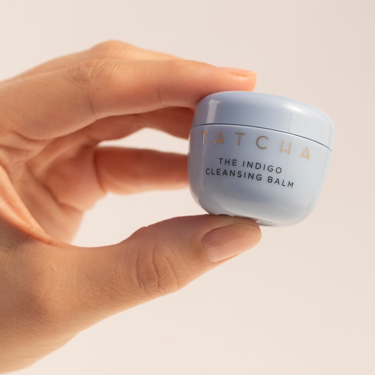 Hand holding Indigo Cleansing Balm Mini