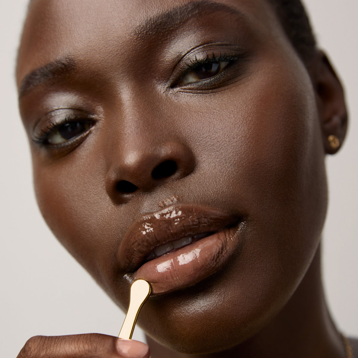 Model application showcasing the Tatcha Kissu Lip Mask