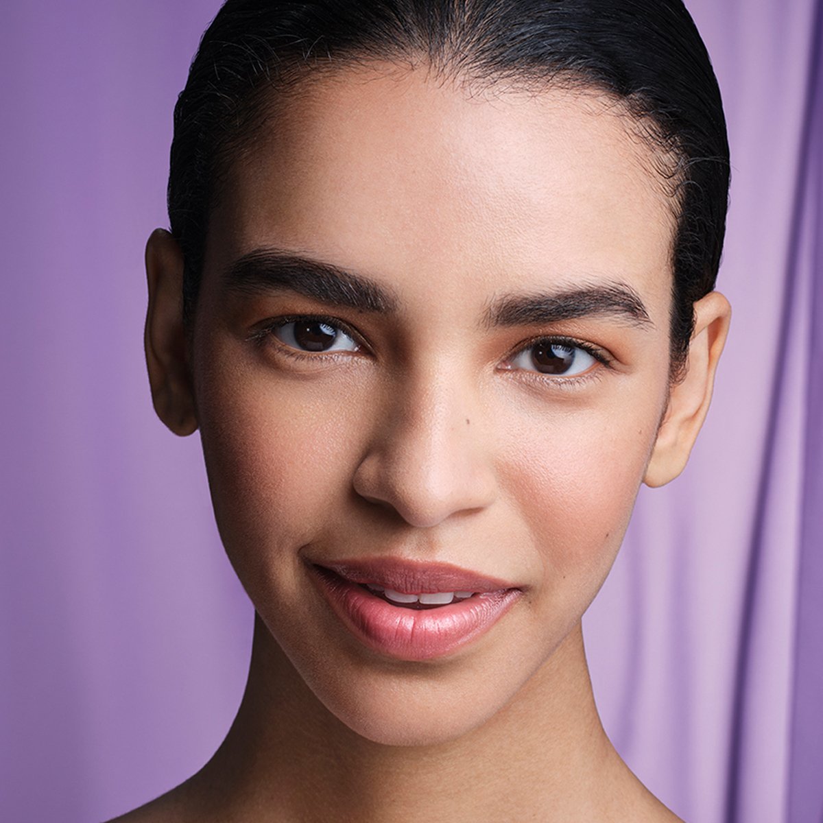 Model with The Liquid Silk Canvas applied to face.