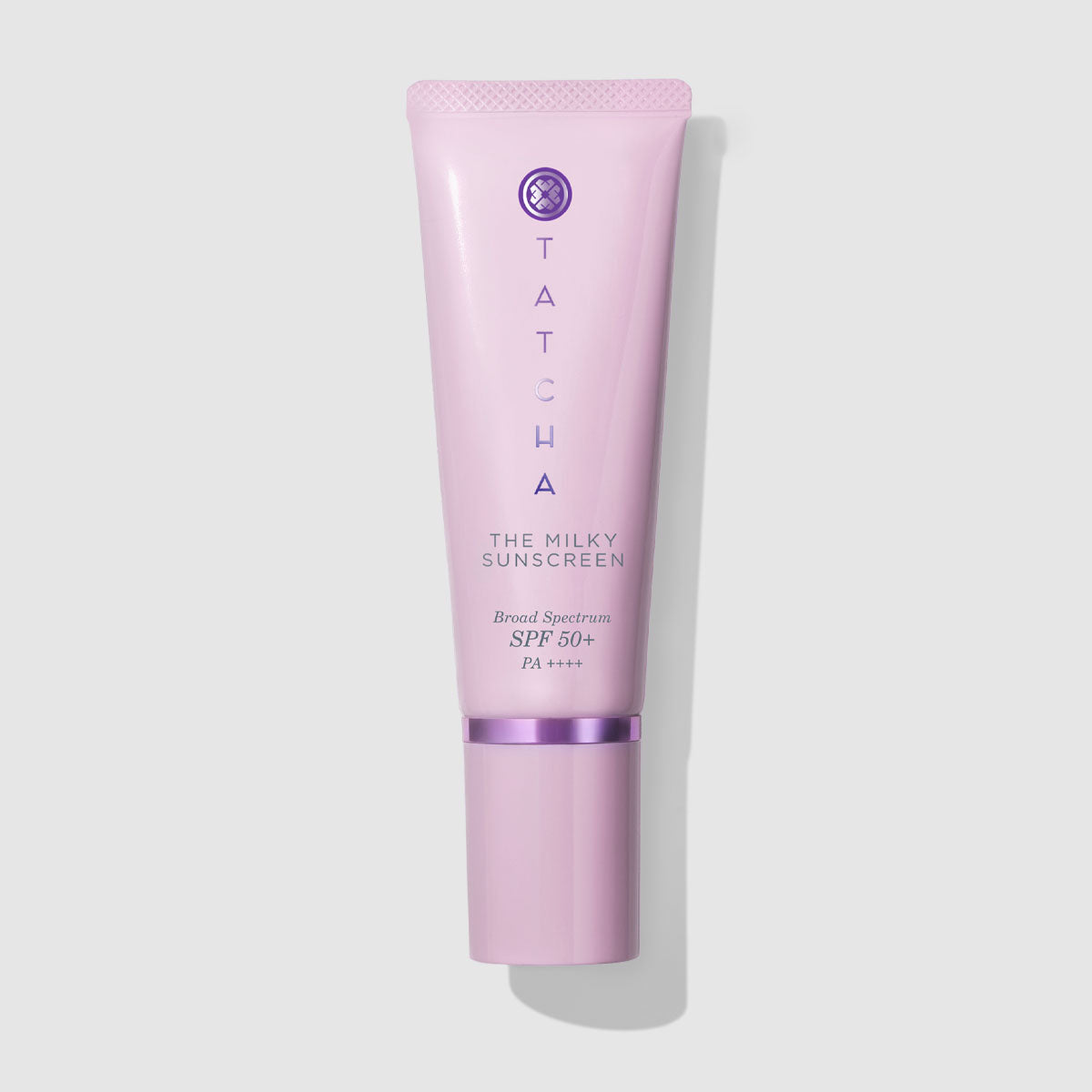 Tatcha The Milky Sunscreen tube on a light gray background