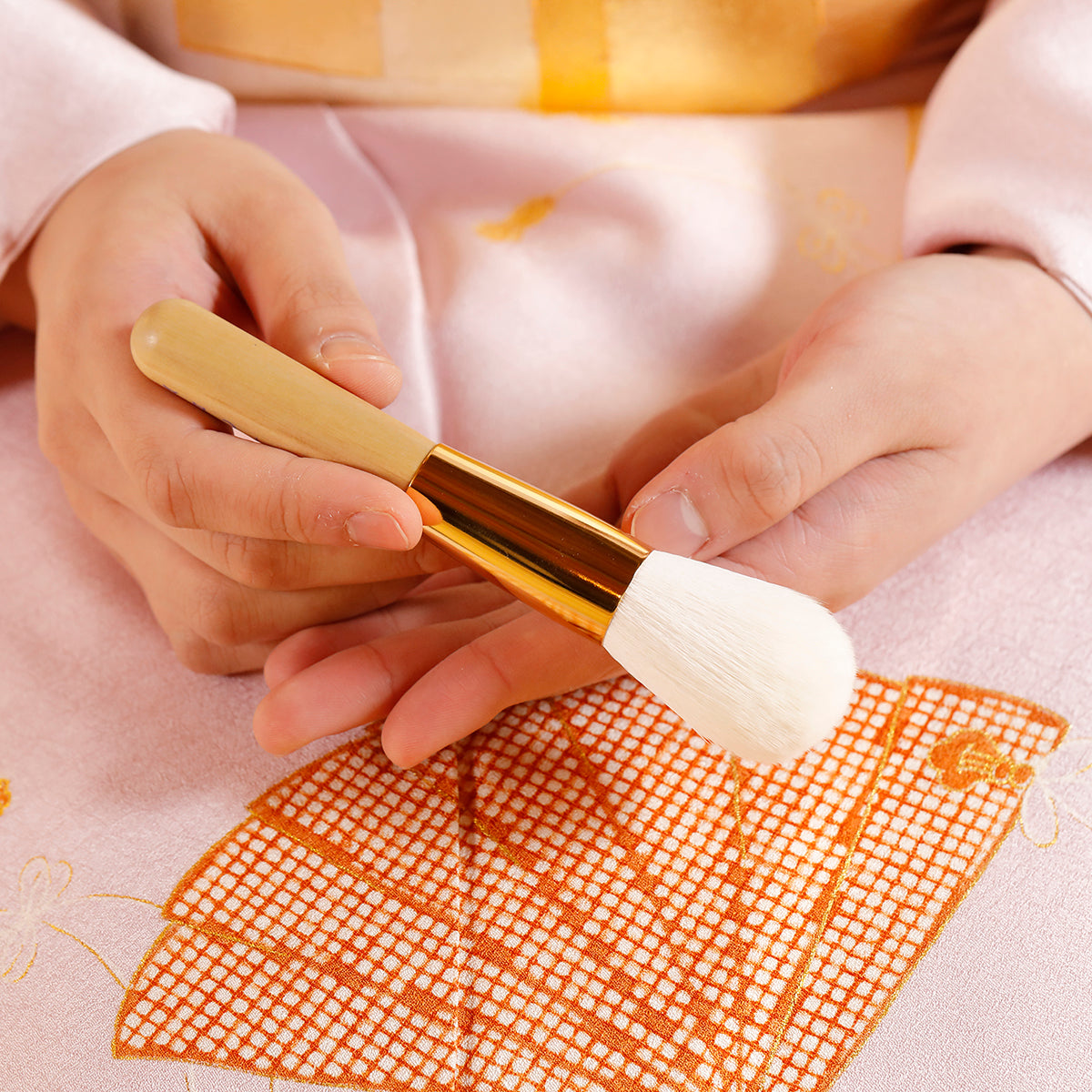 Model holding The Powder Brush