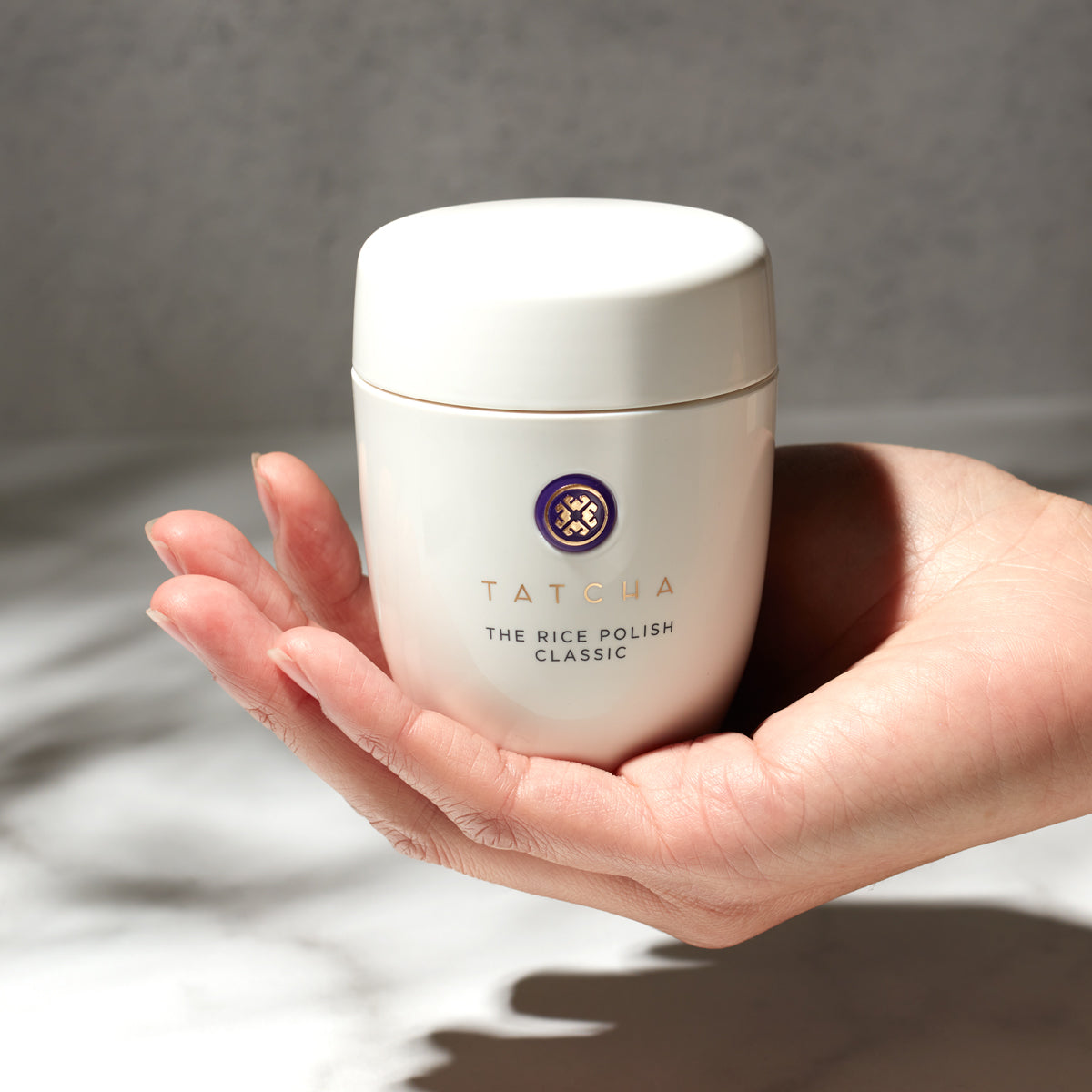 Hand holding Rice Polish Classic