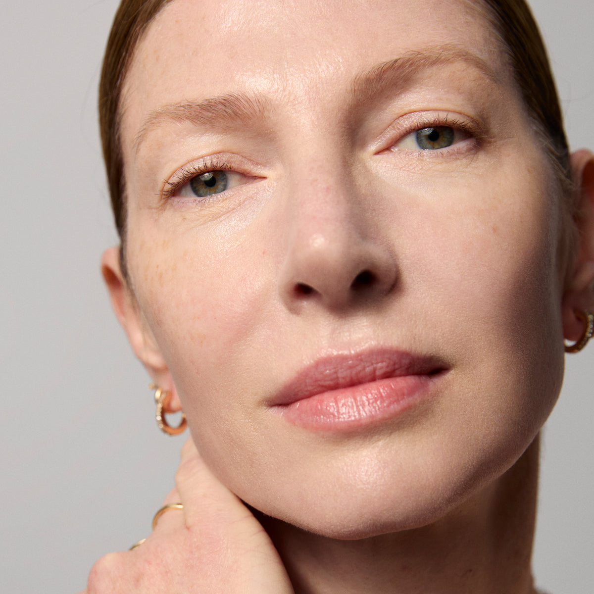 Model skin finish after using the Tatcha Serum Stick