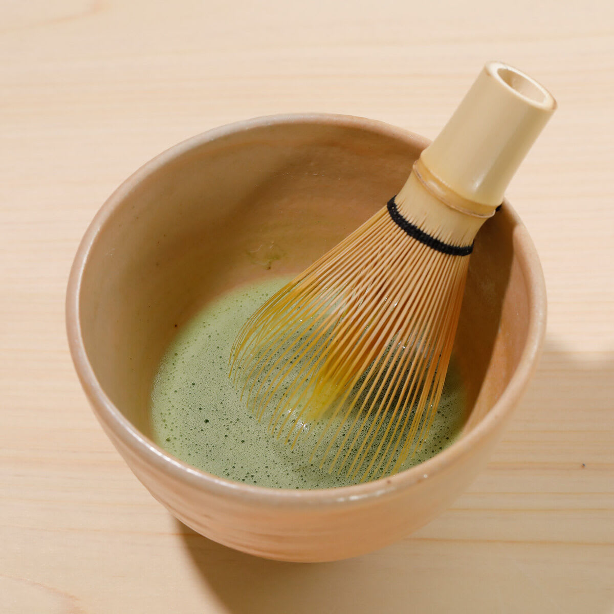 Close up shot of whisked matcha.