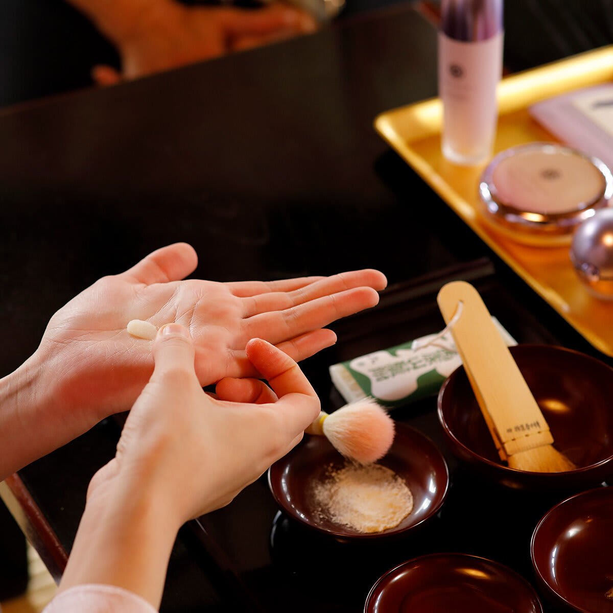 Shot of model with bintsuke on hands.